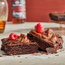 Load image into Gallery viewer, Two brownies with chocolate raspberry honey cream spread.