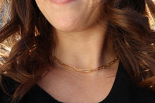 Load image into Gallery viewer, This lightweight statement paperclip chain necklace is gold plated over stainless steel making it water resistant.