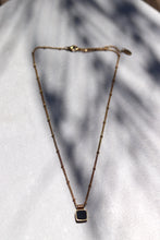Load image into Gallery viewer, Dee Necklace Black. It has a stainless steel base and is gold plated to give it an extra touch of beauty.