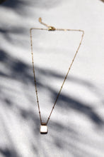 Load image into Gallery viewer, Dee Necklace White has a stainless steel base and is gold plated to give it an extra touch of beauty. This dainty necklace has a white shell pendant accent and is water proof!
