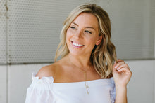 Load image into Gallery viewer, Lady smiling and touching her hair wearing the 3 in 1 necklace around her neck.