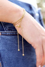 Load image into Gallery viewer, Lady wearing the 3 in 1 necklace in gold, wrap it 3 times for a bracelet