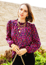 Load image into Gallery viewer, Lady wearing the Floral Print Top.  Purple floral puffed sleeves that add a touch of charm to any outfit. 
