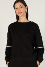 Load image into Gallery viewer, Lady wearing the Black Pearl Sweater.
