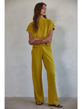 Load image into Gallery viewer, Lady wearing the cozy Chartreuse Top with the matching pants.
